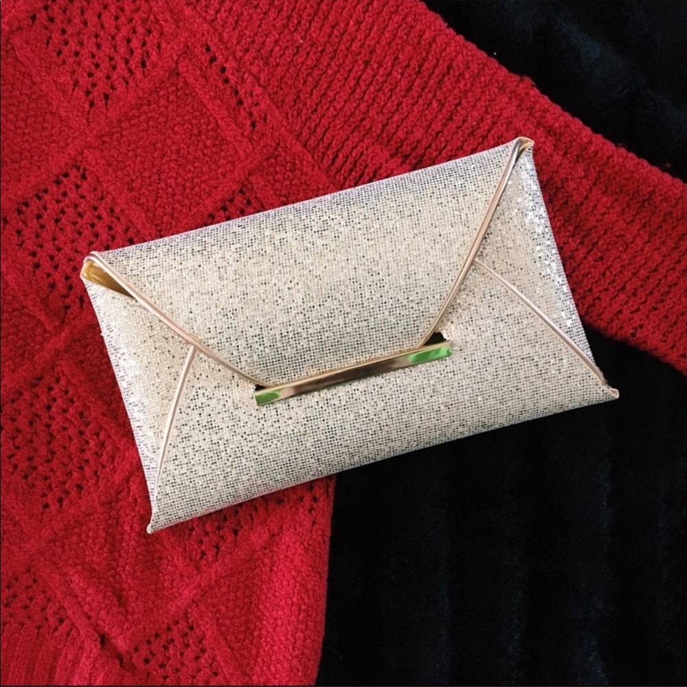 Glittery gold envelope clutch